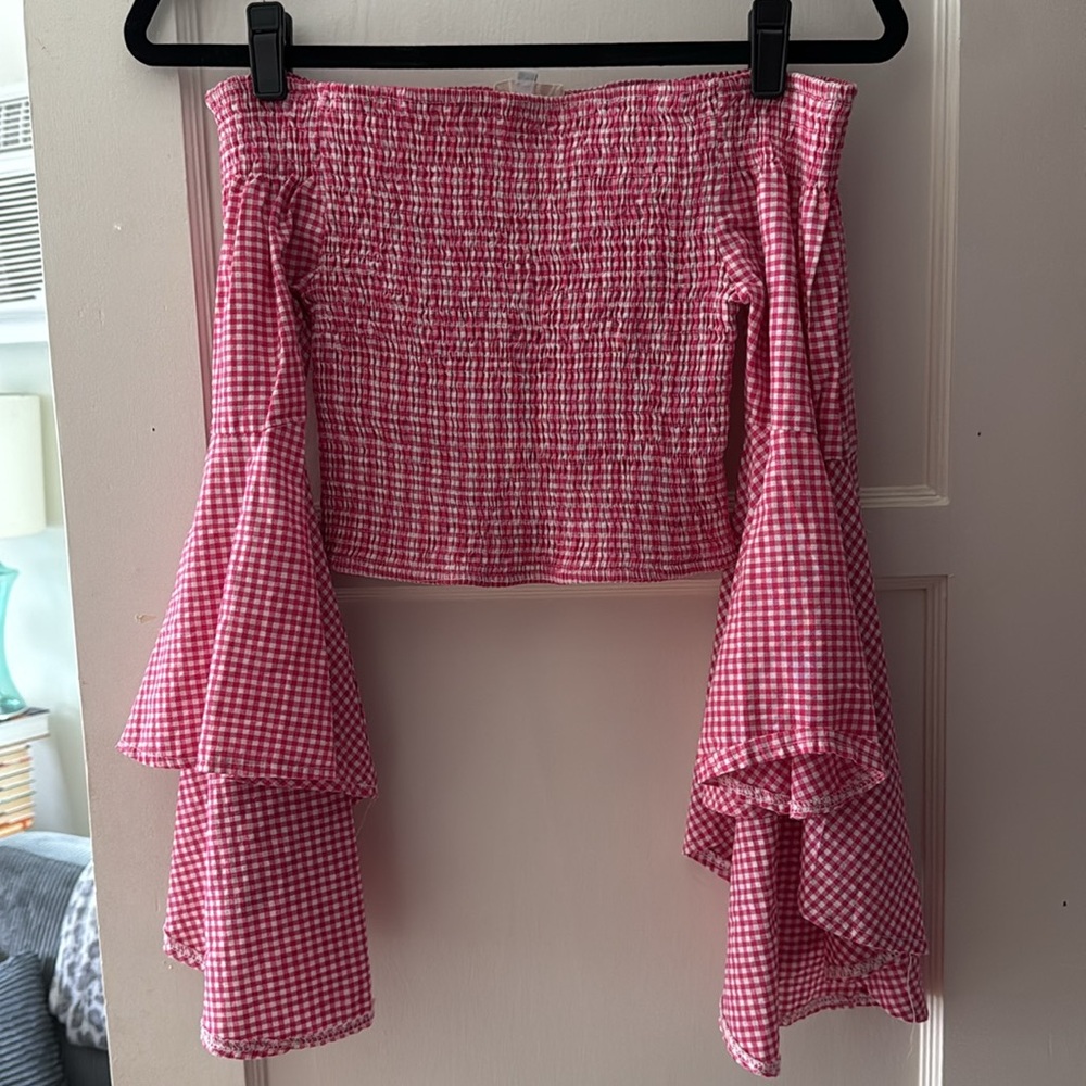 Off the shoulder pink gingham blouse with dramatic sleeves